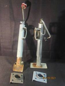 lot 246 image: 2 TRAILER JACKSTAND 1 HAS BENT SKID PLATE MOUNTING BRACKETS INCLUDED