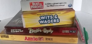 lot 72 image: Board Game Lot, including Vintage Annie Game and Unopened Zombieopoly