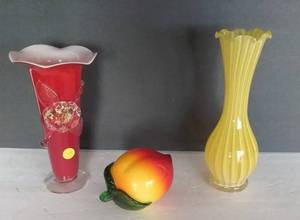 lot 144 image: 3 Pc of Art Glass, including Blown Glass Peach, Norleans Vase, Red Cased Glass Vase Ruffled Top.