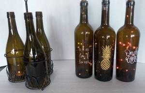 lot 15 image: 3 Wine Bottles with lights, and Triple Wine Bottle Tealight Candlelabra