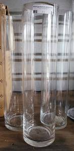 lot 3 image: LOT OF 3 LARGE CLEAR GLASS CYLINDER VASES IN STYLECOLORCONDITION SHOWN. (2) 19.5 H x 5 DIA, (1) 19.5H x 5.5 DIA. (YOUR BID X 3)