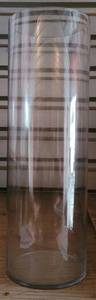 lot 26 image: LARGE CLEAR GLASS CYLINDER VASE IN STYLECOLORCONDITION SHOWN. APPROX. 23.5 H x 7.75 DIA.