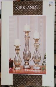 lot 28 image: KIRKLANDS SET OF THREE MERCURY GLASS CANDLE HOLDERS IN BOX AS SHOWN.