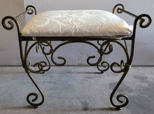 lot 104 image: WROUGHT IRON FRAME WITH CUSHIONED SEAT BENCH IN STYLECOLORCONDITION SHOWN. APPROX. 23.5 W x 14 D x 19 H.