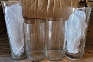 lot 286 image: LOT OF 13 CLEAR GLASS CYLINDER VASES IN ASSORTED SIZES AS SHOWN. SIZES RANGE FROM 7.5 H x 4 DIA TO 11 H x 3 DIA. (YOUR BID X 13)