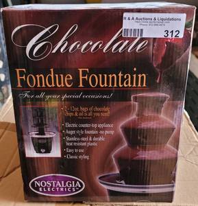 lot 312 image: NOSTALGIA ELECTRICS CHOCOLATE FOUNTAIN CFF965 IN BOX AS SHOWN.