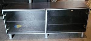 lot 318 image: MEDIA CABINET WITH DOUBLE GLASS DOORS IN STYLECOLORCONDITION SHOWN. APPROX. 47.25 W x 16.5 D x 19 H.