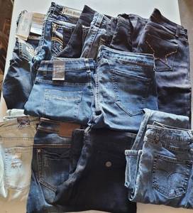 lot 339 image: LOT OF 12 PAIR OF JEANS IN ASSORTED SIZESSTYLESCOLORS AS SHOWN. SOME HAVE TAGS. (YOUR BID X 12)