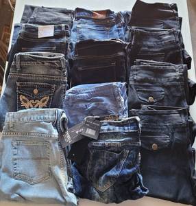 lot 340 image: LOT OF 12 PAIR OF JEANS IN ASSORTED SIZESSTYLESCOLORS AS SHOWN. SOME HAVE TAGS. (YOUR BID X 12)