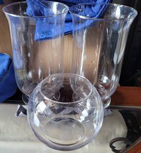 lot 397 image: LOT OF 3 CLEAR GLASS VASES IN ASSORTED STYLES AS SHOWN. (2) 12 H x 7 DIA (1) 6.5 H x 8 DIA. (YOUR BID X 3)