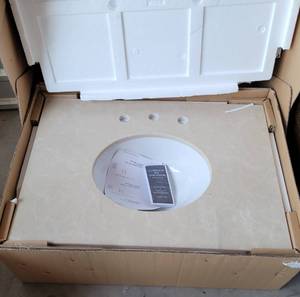 lot 406 image: MARBLE VANITY TOP WITH SINK #31998 IN BOX AS SHOWN. APPROX. 31 x 22.