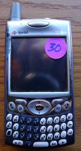 lot 30 image: Vintage Sprint Palm Powered cell phone