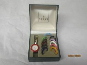 lot 70 image: GUCCI SWISS MADE WOMENS WATCH WITH 11 INTERCHAGEABLE BEZELS IN ORIGINAL BOX&nbsp&nbsp