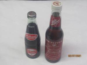 lot 243 image: TOTAL OF 2 VINTAGE DR PEPPER BOTTLES NOT FOR CONSUMPTION&nbsp- 1994 OPENING DAY FOR THE BALL PARK IN ARLINGTON&nbsp&nbsp- 2002 FIFTH ANNIVERSARY YEAR LONE STAR PARK&nbsp