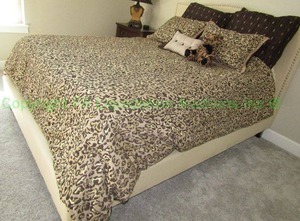 lot 139 image: Richard Mishaan leopard pattern bedding set as shown, bed not included