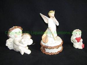 lot 152 image: Angel music box and artist signed bonded marble cherubs