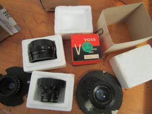 lot 398 image: BUEHLER 50MM & 135MM LENS VOSS 75 MM LENS & 3 ADDITIONAL LENSES