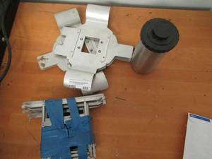 lot 402 image: NEGATIVE ENLARGER TRAYSHOLDER X 6  AND FILM CANISTE