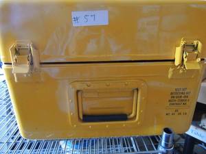 lot 57 image: Yellow metal lock box with 6 Tube Tents SET UP and first aid items inside