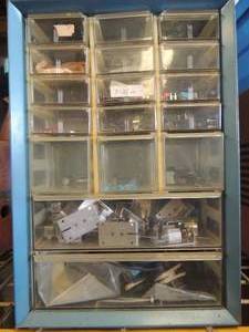 lot 149 image: 17 drawer blue wall shelf 14.5 x6x10.5 has misc. items