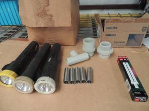 lot 230 image: Box of phillips 13 watt bulbsbox of flashlights 2.5 metal pieces 7 loose flashlights CPVC 1.5 pipe fittings