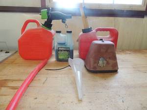 lot 606 image: 2x 1gal. Gas canused bottle master pro synthetic blend 2 cycle oil- plastic funnel hyd cover