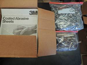 lot 770 image: Coated adhesive sheets 4 packs in a box  Bag of long screws bag of drill bits and wrenches