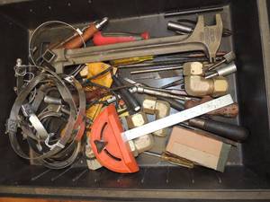 lot 863 image: Box of pipe fittings clamps screw drivers plyers and more