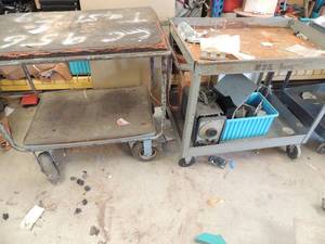 lot 937 image: 2 metal rolling carts(contents NOT included) blue one has flat wheels