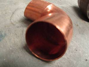 lot 929 image: 1 12 COPPER ELBOWS QTY  APPROX 25