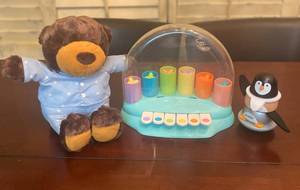 lot 206 image: Mirari Pop Pop Piano Press the keys to hear a sound and see a star pop up, 2 sound modes musical notes and silly sounds. Hallmark Interactive Story buddy stuffed animals, Jaod Penguin Culbuto Multicolored