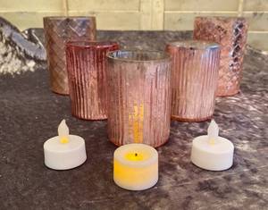 lot 721 image: 5 Rose Gold Votive Candle Holders and 3 Battery Candles