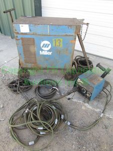 lot 93 image: Miller CP-300 arc welder with accessories, on cart