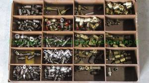 lot 34 image: Assorted brass & stainless steel industrial fittings in storage box
