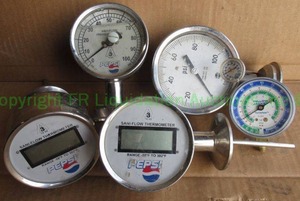 lot 61 image: Assorted industrial gauges including Pepsi logo gauges