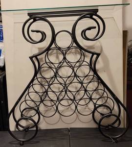 lot 21 image: METAL WINE RACK TABLE WITH GLASS TOP IN STYLECOLORCONDITION SHOWN. APPROX. 27 W x 14 D x 28 H.