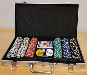 lot 44 image: CASINO SET INCLUDING CHIPS, DECK OF CARDS, DICE, AND STORAGECARRYING CASE AS SHOWN. THE SET IS HEAVY.