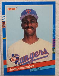 lot 69 image: 1991 DONRUSS #371 JUAN GONZALEZ TEXAS RANGERS BASEBALL CARD IN PROTECTIVE SLEEVE AS SHOWN.