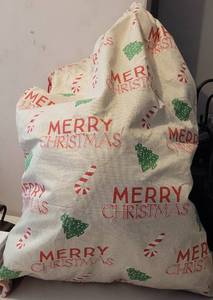 lot 74 image: LARGE SIZE CHRISTMAS SANTAS GIFT BAG FULL OF LIGHTED GARLAND AS SHOWN.