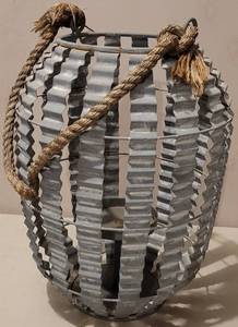 lot 81 image: GALVANIZED METAL STYLE CANDLE HOLDER  CENTERPIECE IN STYLE, COLOR, AND CONDITION SHOWN. APPROX. 8.5 DIA. x 12 H.