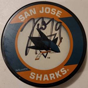 lot 84 image: SAN JOSE SHARKS HOCKEY PUCK SIGNED BY #9 AS SHOWN.
