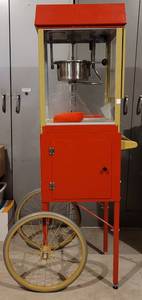 lot 121 image: GOLD MEDAL FUN POP POPCORN MACHINE MODEL 2404 AND CART MODEL 2649 IN WORKING CONDITION AS SHOWN.