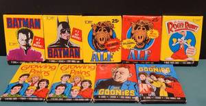 lot 110 image: LOT OF 9 UNOPENED PACKS OF 1980S TOPPS TRADING CARDS AS SHOWN. (2) BATMAN, (2) ALF, (1) ROGER RABBIT, (2) GROWING PAINS AND (2) THE GOONIES. (YOUR BID X 9)
