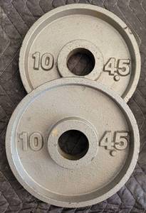 lot 142 image: LOT OF 2 BARBELL WEIGHT PLATES AS SHOWN. 10 LBS EACH. (YOUR BID X 2)