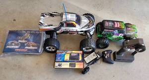 lot 150 image: LOT OF 2 REMOTE CONTROLLED TRUCKS WITH ACCESSORIES AS SHOWN.