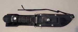 lot 182 image: 420 STAINLESS STEEL TAIWAN SURVIVAL HUNTING KNIFE WITH SAW AND BOTTLE OPENER ON BLADE. KNIFE COMES WITH CASE AND SHARPING STONE. APPROX. 11.25 LONG OVERALL WITH 5.75 BLADE.