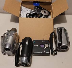 lot 234 image: ASSORTED DIGITAL CAMERAS AND VIDEO CAMERAS AS SHOWN.