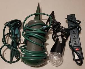 lot 239 image: OUTDOOR LIGHT STAKES AND POWER STRIP AS SHOWN.