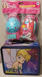 lot 291 image: TINKER BELL LUNCHBOX AND BARBIE KNEE PADS AS SHOWN.