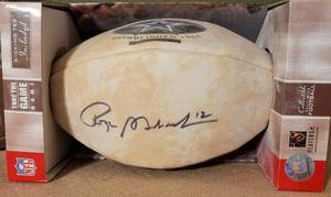 lot 184 image: PLAYERS INC. COMMEMORATIVE FULL SIZE DALLAS COYBOYS FOOTBALL SIGNED BY LEDENDARY QUARTERBACK AND HALL OF FAMER ROGER STAUBACH #12 AS SHOWN.